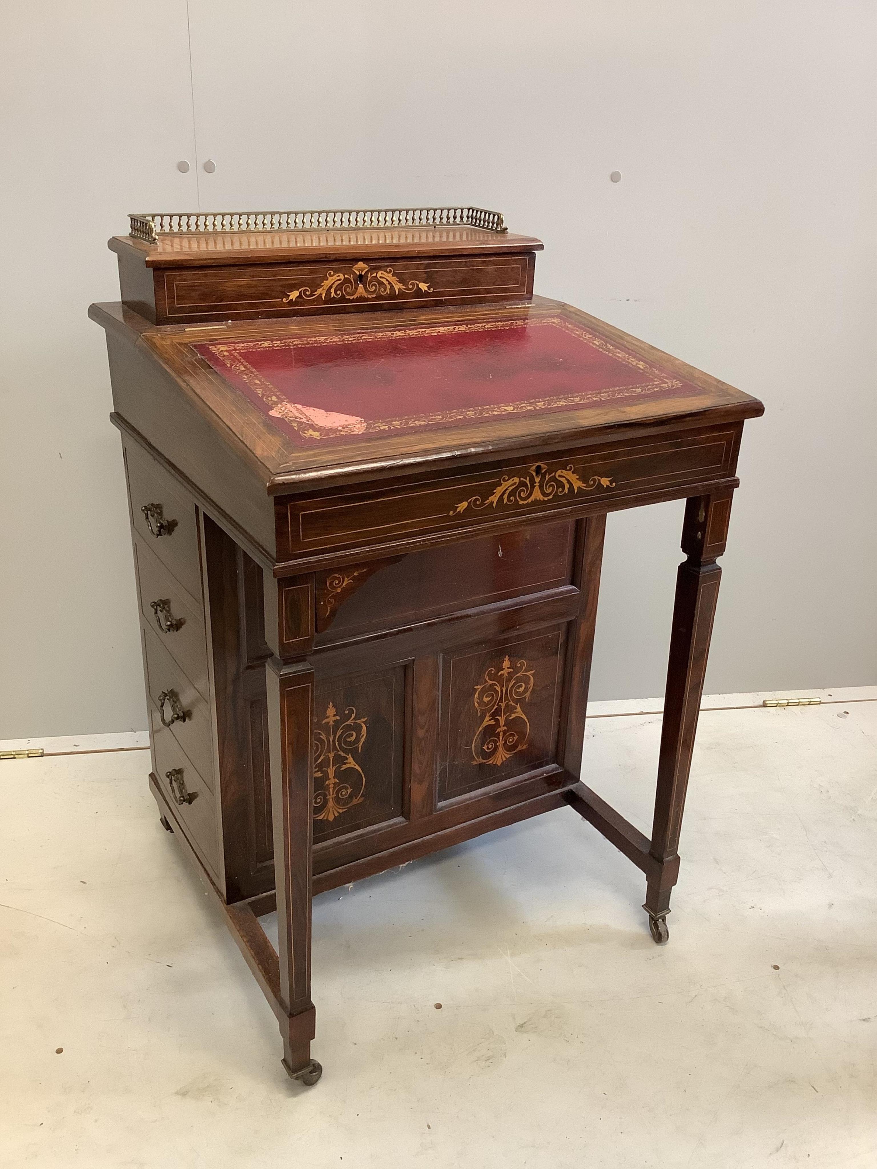 A late Victorian inlaid rosewood davenport, width 56cm, depth 53cm, height 84cm. Condition - fair